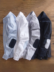 製品画像: パッチワークデザインが施されたオックスフォードシャツの正面全体展示。