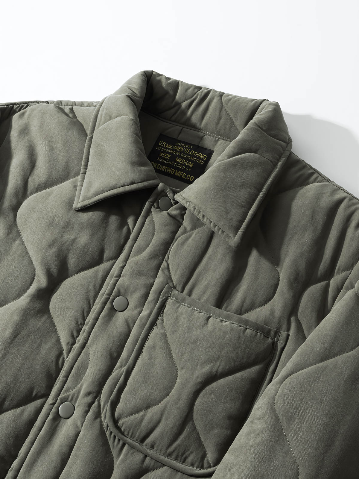 製品画像: ヴィンテージ風ひょうたん型キルティング中綿ジャケットのフロントビュー
詳細画像: ひょうたん型キルティング模様のディテール特写