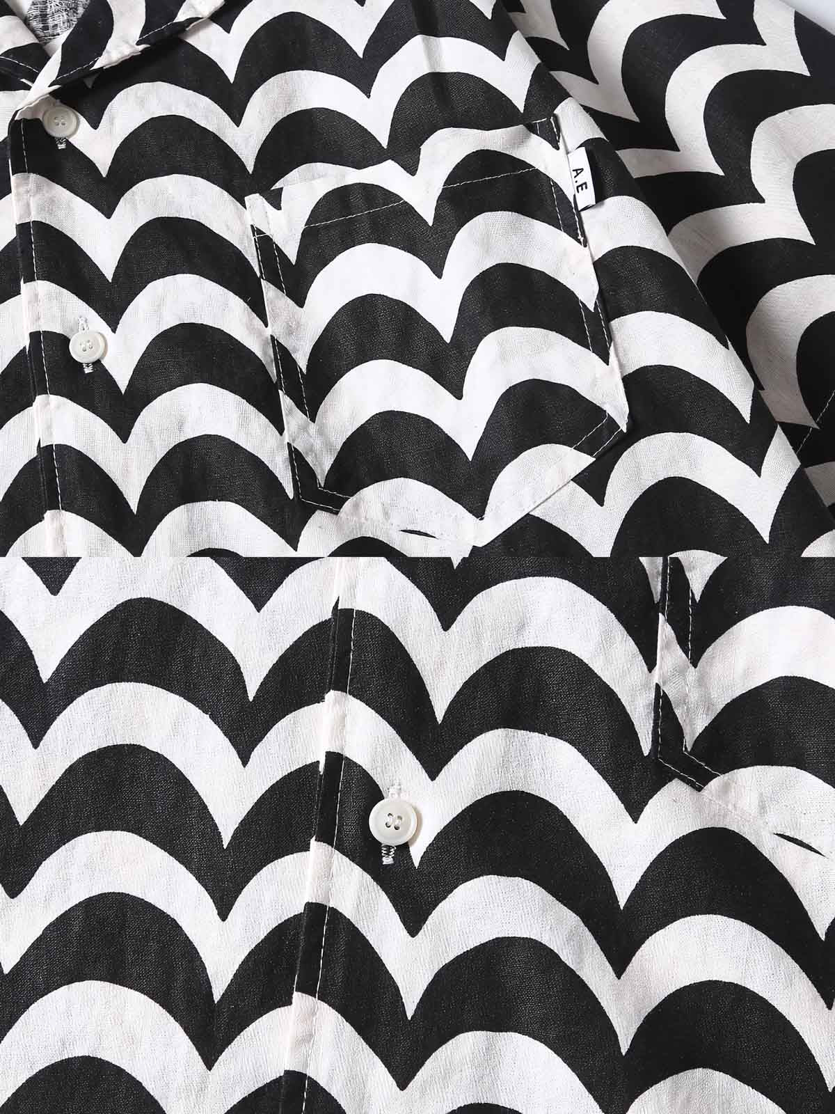 リネンシャツの細かな波状パターンのクローズアップ。黒と白のコントラストが特徴で、精緻な縫製技術を見せる。