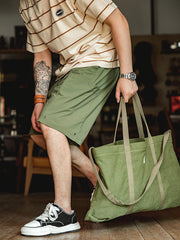 詳細画像:スナップボタン付きドローコードと大容量ポケットのディテール