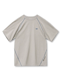 ネイビーのTシャツ、ラグラン袖と脇に沿った白い配色フラットロックステッチ