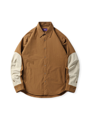 速乾性と伸縮性に優れた素材のアウトドアシャツ。翻領、アーチ裾、対比カラーのパッチワークが特徴。