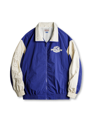 90年代レーサーカルチャー着想の鮮やかなカラーブロックと刺繍入りレーシングジャケット。