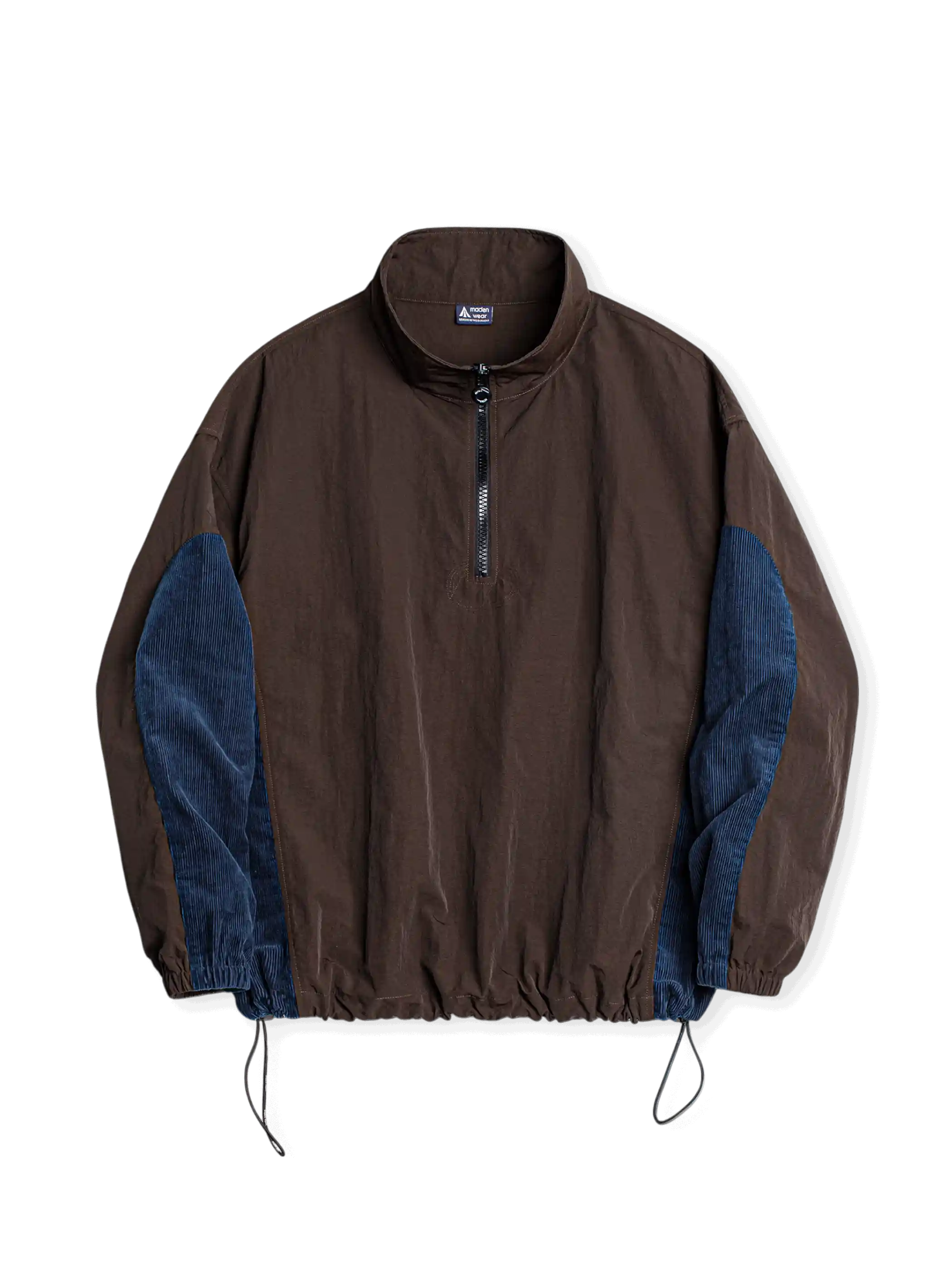 軽量シボ加工ナイロンとヴィンテージブルーコーデュロイのパネルコンビネーションハーフジップジャケット。プロテクションパネル付き。