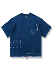 藍染の抜染ペイズリー柄パッチワークとドローコード付きヘムを特徴とするゆったりボックスシルエットコットンTシャツ