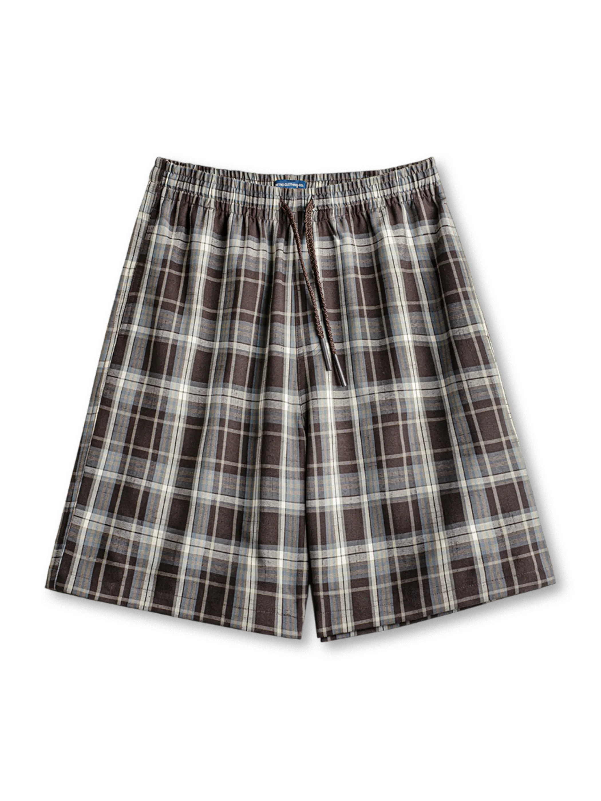 歴史あるタータンチェック柄とドローストリングウエストが特徴の膝上丈ワイドショーツ