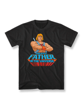 『マスターズ・オブ・ユニバース』カートゥーンプリントTシャツ正面図、He-Manと「Greatest Father in the Universe」標語