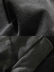 製品画像: インディゴウォッシュのヴィンテージ風長袖Tシャツの正面展示
詳細画像: Tシャツの襟元と袖口の三角カットディテールのクローズアップ