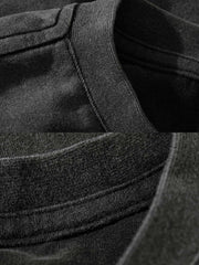 製品画像: インディゴウォッシュのヴィンテージ風長袖Tシャツの正面展示
詳細画像: Tシャツの襟元と袖口の三角カットディテールのクローズアップ