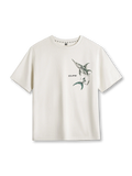 錯視風マーリンプリントが特徴のトライバルモチーフ白Tシャツ