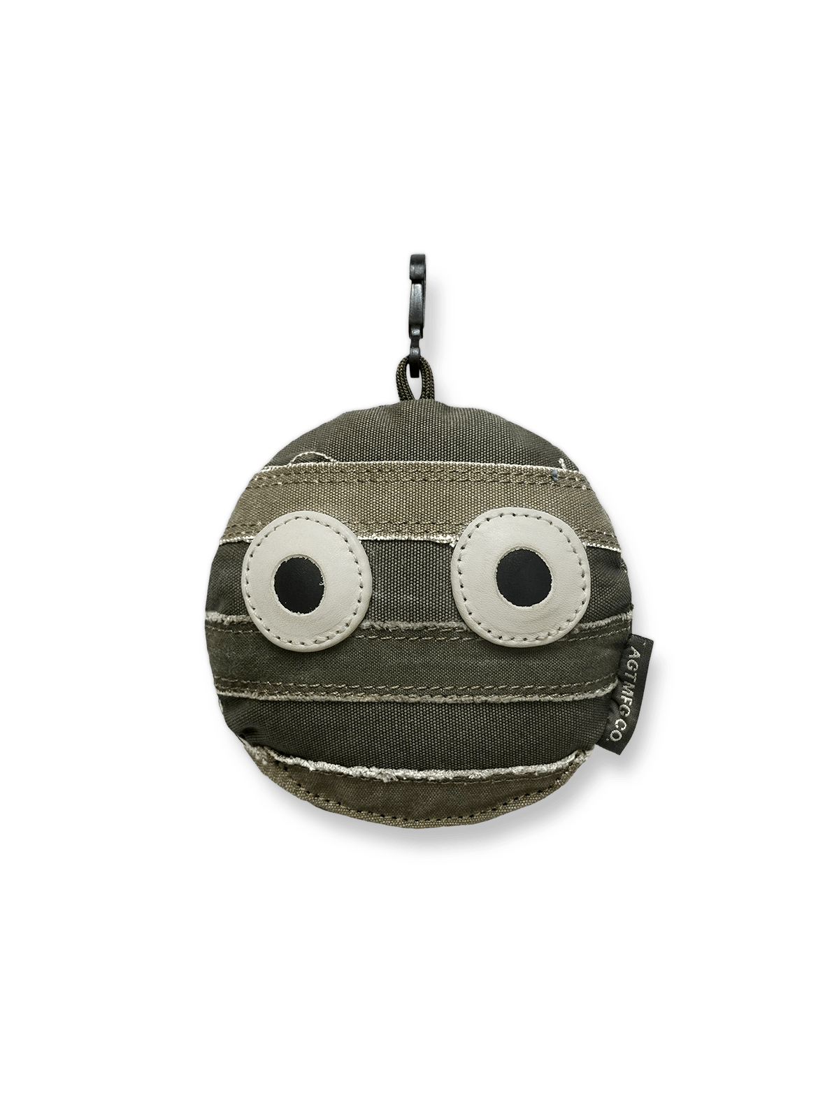 ウォッシュ加工を施したキャンバス素材にカートゥーンフェイスをあしらったヴィンテージチャーム