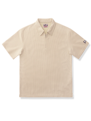 ワッフル生地のハーフジップポロシャツ。