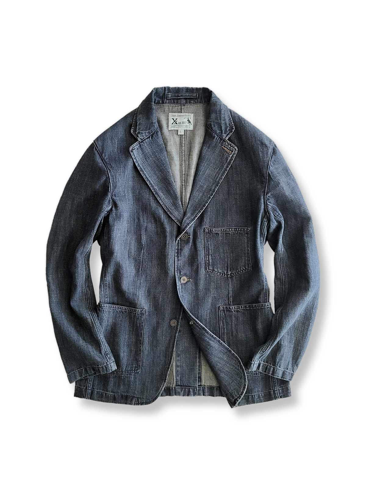 ウォッシュ加工が施されたリネンコットン混紡のデニムブレザー。