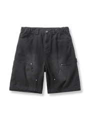 ウォッシュド加工とディストレストディテールが特徴のコットン伐採ショーツ。