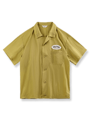 ナイロン素材のウォッシュ加工でシワ感を出したマスタードイエローのキューバカラーシャツ
