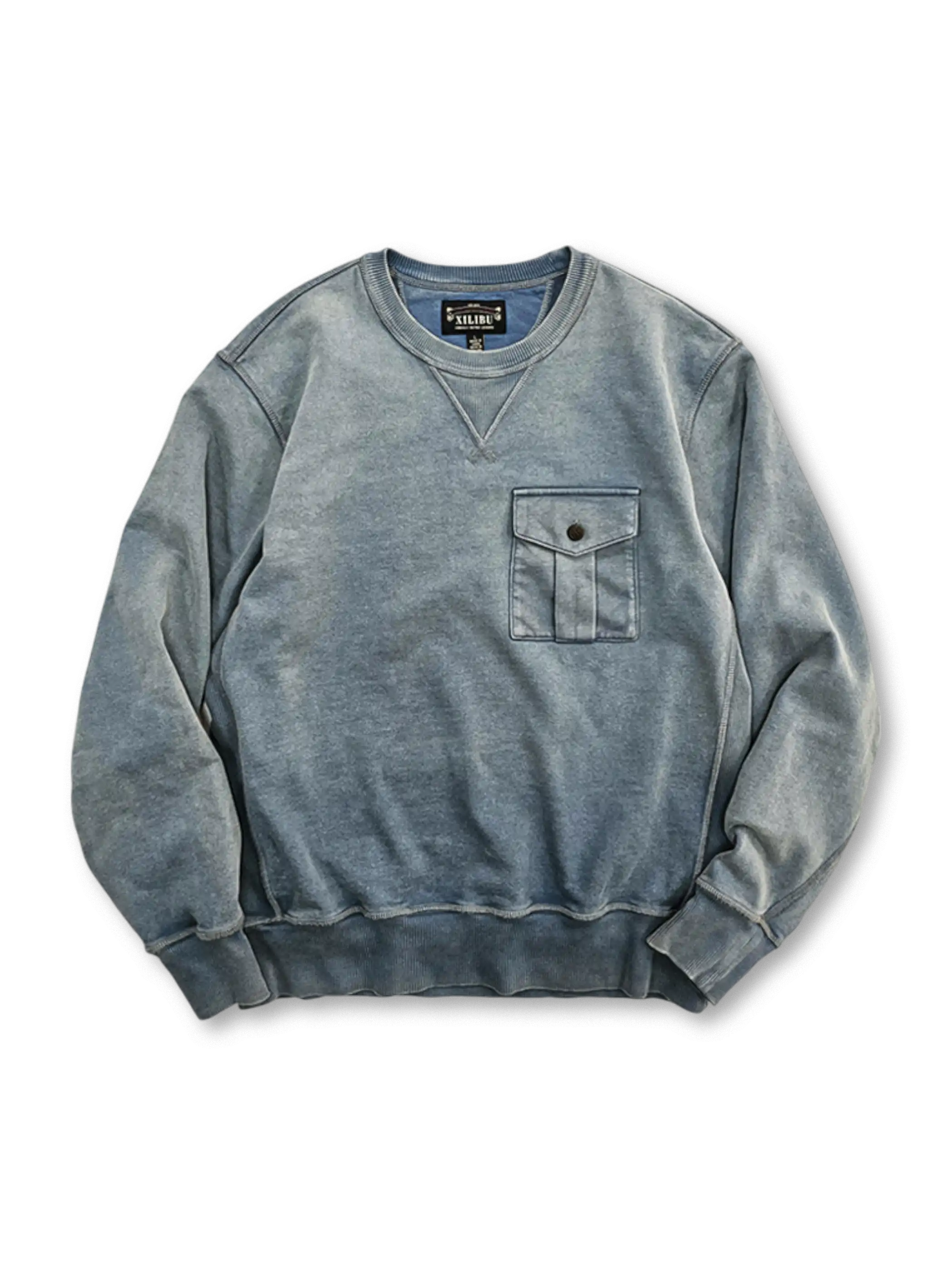 ワックス染めと抜染風加工が施されたデニムブルーカラーのスウェットシャツ