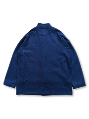 デニム生地と手織り布の幾何学パッチワークが特徴的なジャケット前面