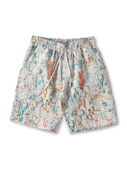  レトロなドパミンカラーのジャカード織ショーツ。軽量ポリエステル素材でドローストリング付きウエスト。ストリートとヴィンテージアートが融合したデザイン。