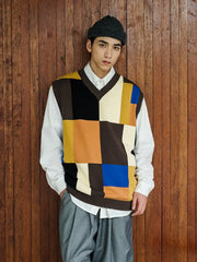 七色パッチワークチェッカーボードVネックベスト、老式12針機織加工の質感と豊かな色ブロックが特徴。