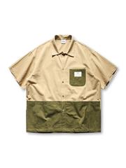 弧形のパネル切り替えが特徴的な半袖シャツ正面全体。襟はシンプルで、胸ポケットとボタンが見える