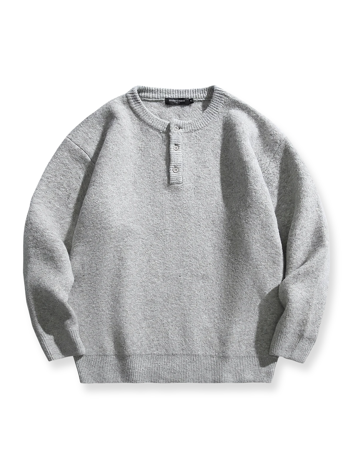 製品画像: 5色展開 ヘンリーネック ニットセーター。クラシックなヘンリーネックデザインと柔らかい混紡素材が特徴のセーターの正面全体展示図。

詳細画像: エレガントなヘンリーネックデザインと、シンプルながらデザイン性の高いボタンディテールのクローズアップ。