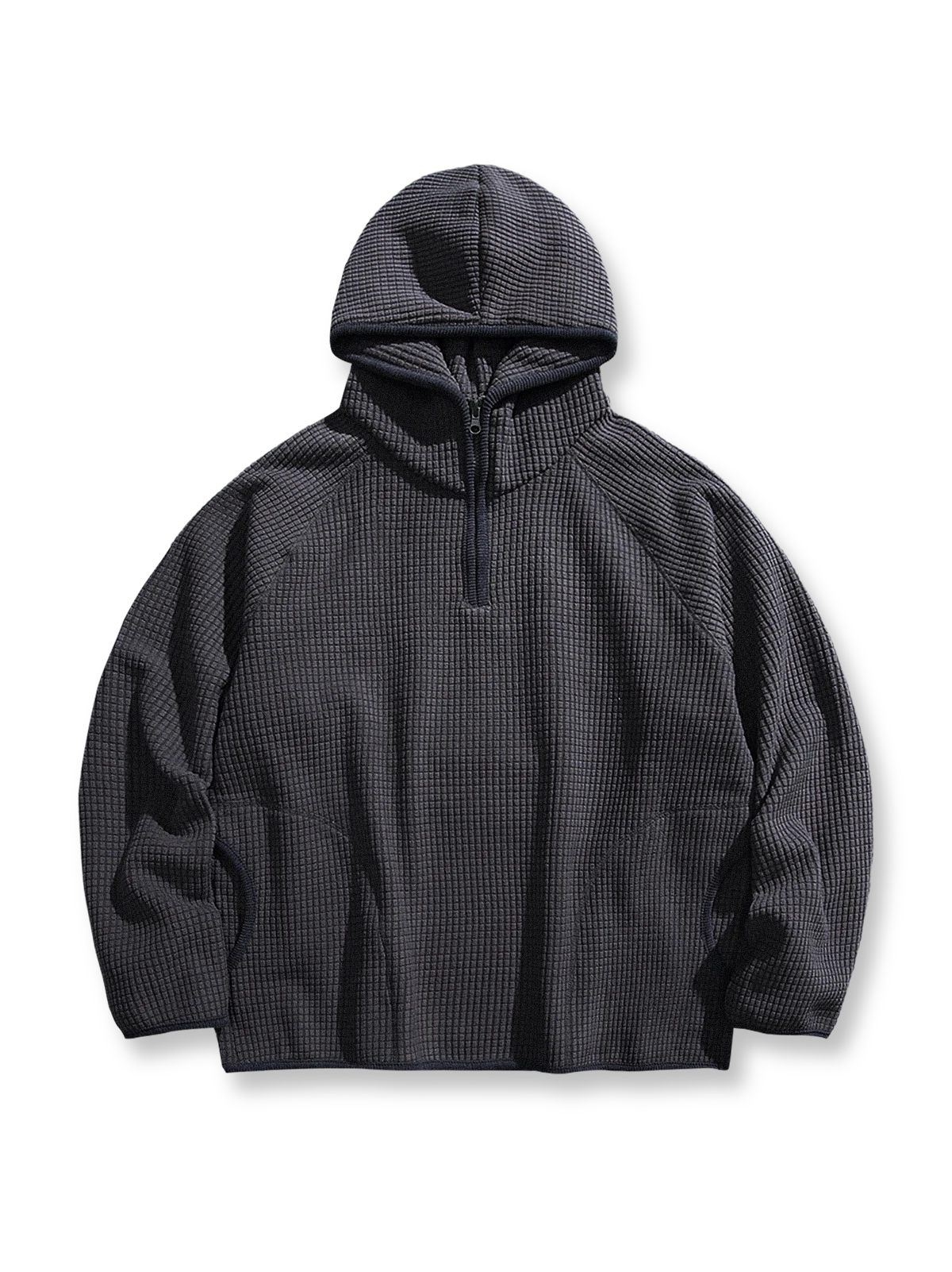 製品画像: 厚手ワッフル織りフード付きスウェット、ヴィンテージ感のあるデザインと裏起毛素材。寒い季節にぴったりの保温性を提供し、快適な着心地。

詳細画像: ワッフル織り生地と裏起毛のディテール。温かみのある厚手素材が、秋冬のコーディネートに最適。