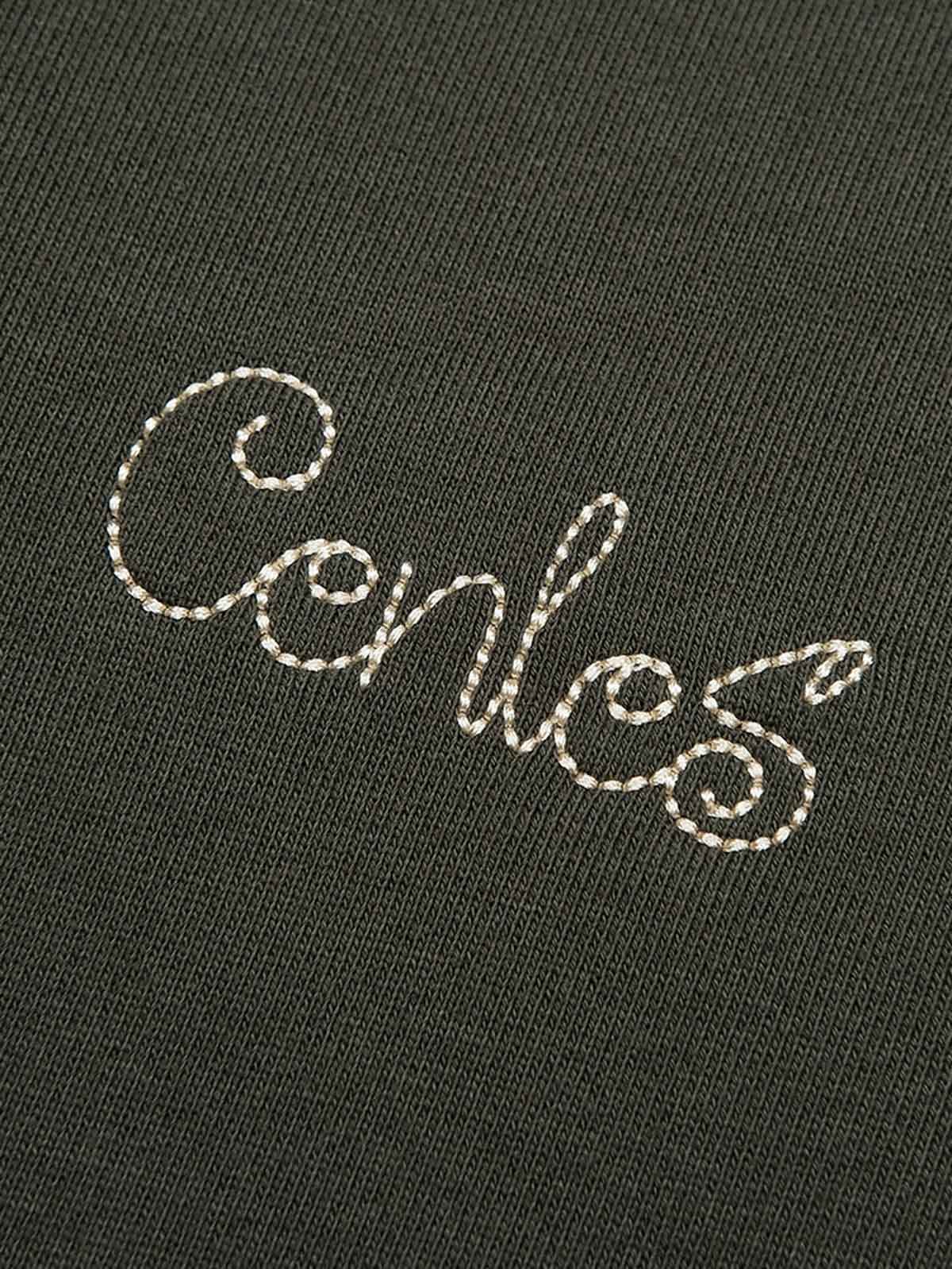 詳細画像: 襟と肩のディテール、ヘリンボーン生地と天然木製ボタンを表示