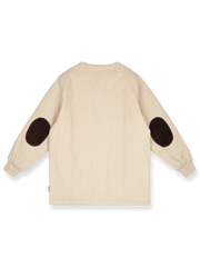 藤とハトをテーマにした中綿ジャケットの全体像。カラーコントラストとストライプテクスチャーを強調。