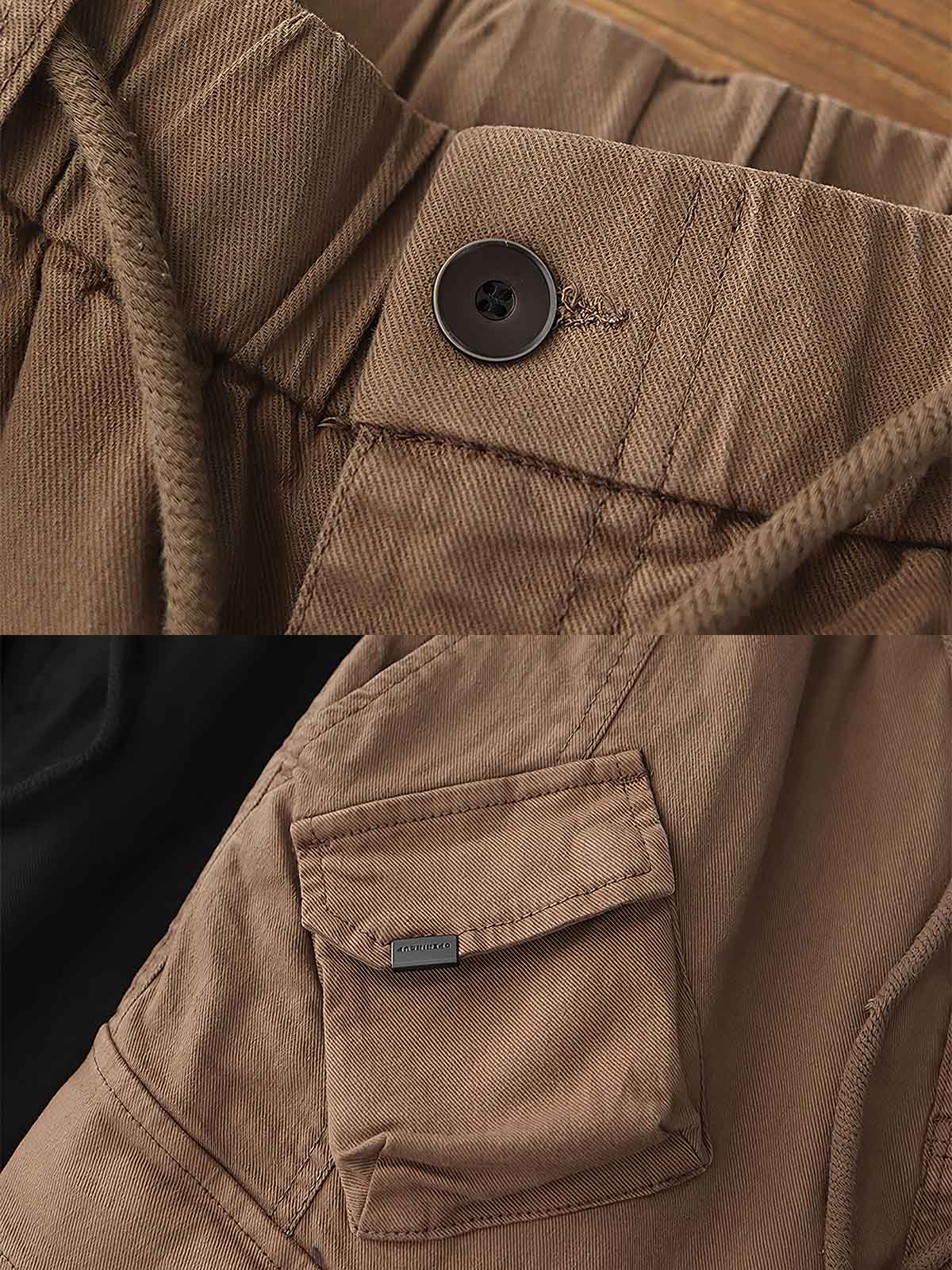 製品画像: ヴィンテージワーク パラシュートジョガーパンツ 正面、ウォッシュ加工とリブウエストデザイン
詳細画像: リブウエストと大きめポケットのディテール、微ストレッチツイル