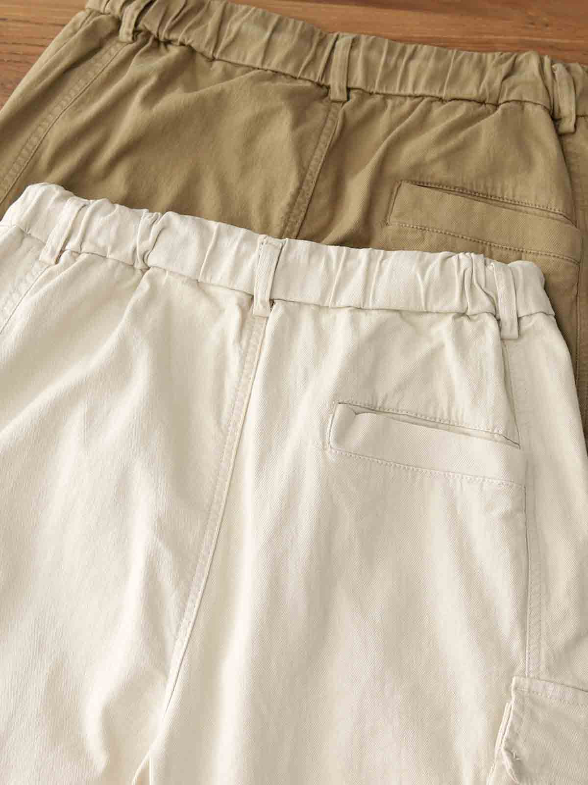 製品画像: ヴィンテージワーク パラシュートジョガーパンツ 正面、ウォッシュ加工とリブウエストデザイン
詳細画像: リブウエストと大きめポケットのディテール、微ストレッチツイル