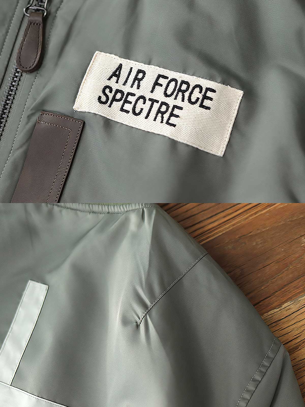 製品画像：ヴィンテージMA-1フライトジャケットの正面図。防水ナイロン素材とオレンジ色の裏地、刺繍バッジが特徴的なデザイン。
詳細画像：刺繍バッジと識別テープ、ジッパーのディテールをクローズアップした画像。ミリタリーウェアの本格的なスタイルを強調。