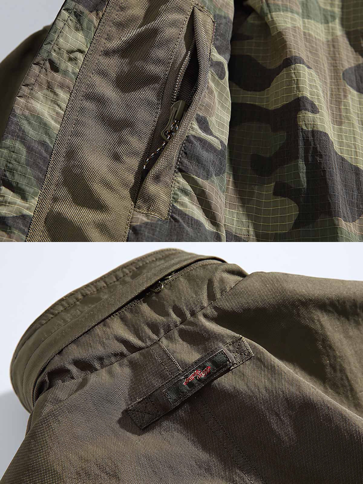 製品画像
アウトドア機能性 速乾 防風 撥水 フード付きジャケットの正面全体像。高密度ナイロンオックスフォードジャカード生地を使用し、三防（速乾、防風、撥水）性能を兼ね備えたデザイン。調整可能なフード付きで、都市からアウトドアまで幅広く活躍。

詳細画像
フード付きジャケットの水平に配置されたポケット部分を特写。フラップ付きポケットの内部には隠しマグネットボタンが内蔵されており、安全性と収納性を向上。高密度ナイロン素材の撥水加工とディテールが際立つ特写画像。