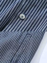 シャツのディテール展示（ストライプパッチワークと刺繍デザイン）