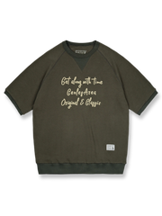 アメリカンレトロスタイルのワッフル格子模様のラグランスリーブ半袖Tシャツの正面ビュー。ネックラインに三角形の補強が施され、レトロなデザインが際立っています。