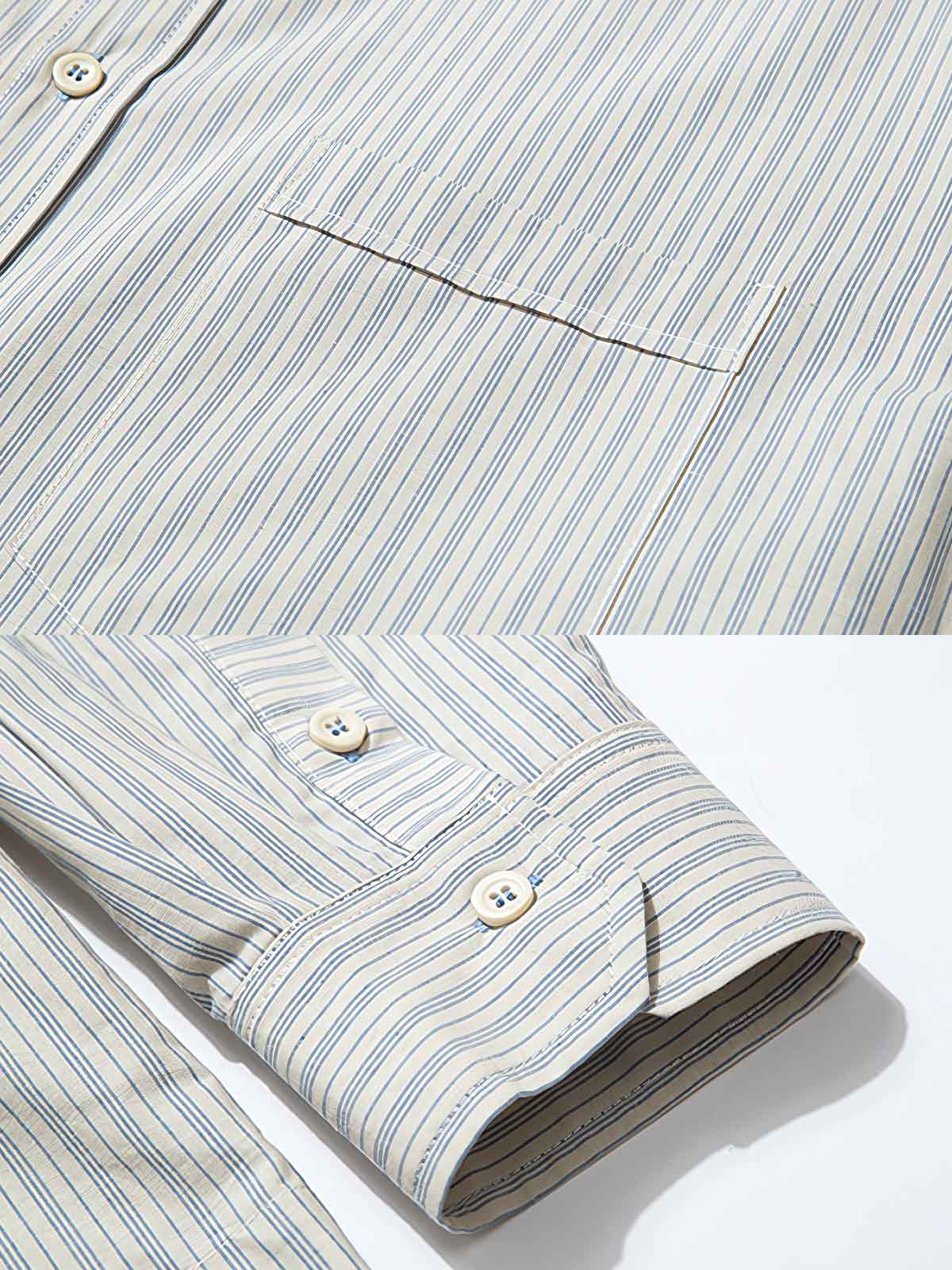 製品画像: クラシックなブルーの細ストライプデザインを採用した100%コットン製の長袖シャツ全体展示、シンプルで万能なレトロなスタイル
詳細画像: ブルーの細ストライプと胸元のポケットディテール特写、ヴィンテージカットが強調された部分