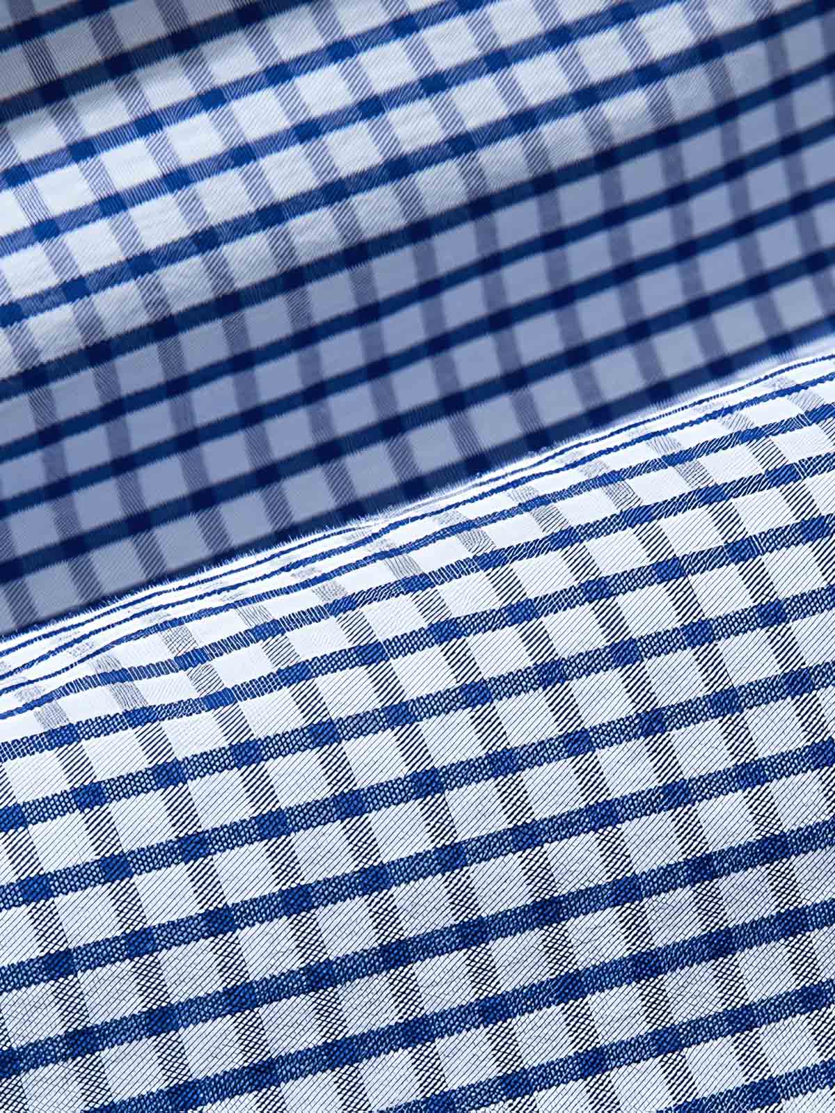 製品画像: リバーシブルデザインとヴィンテージチェック柄が融合した美式ヴィンテージスタイルのハリントンジャケット全体展示、100%コットン素材で快適な着心地
詳細画像: 袖口のバイカラー折り返しデザインとリバーシブルデザインのディテール、ヴィンテージチェック柄と単色面が交互に見える部分のクローズアップ