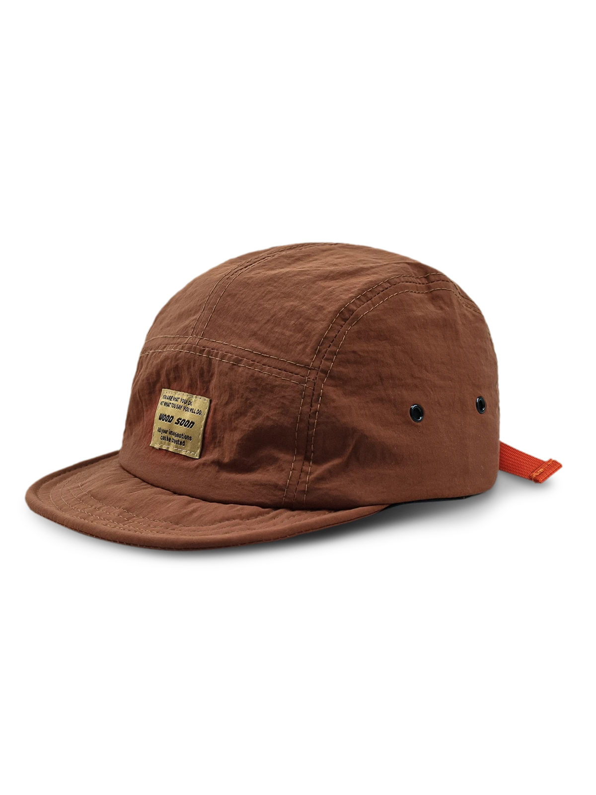 エクスプローラーハットの通気孔とオレンジ色のプルタブのクローズアップ、耐摩耗性に優れたナイロン素材。