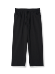 製品画像: レトロなコットン混紡ニットスウェットパンツの全体展示。シンプルなストレートシルエットとロールアップ裾が特徴のカジュアルスウェットパンツ。

詳細画像: ウエスト部分のゴムとドローストリング、裾のロールアップディテール特写。ウエストと裾のデザインが引き立つ特写。