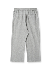 製品画像: レトロなコットン混紡ニットスウェットパンツの全体展示。シンプルなストレートシルエットとロールアップ裾が特徴のカジュアルスウェットパンツ。

詳細画像: ウエスト部分のゴムとドローストリング、裾のロールアップディテール特写。ウエストと裾のデザインが引き立つ特写。