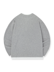 製品画像: ヘンリーネック レイヤード風 ワッフル 長袖Tシャツ全体展示。ヘンリーネックとレイヤード風デザインが融合したスタイル、ワッフル生地が独特の質感を引き立て、洗練されたカジュアル感を演出。

詳細画像: ワッフル生地のテクスチャーとレイヤードデザインの特写。独自の質感とディテールが着こなしに深みを加え、シンプルでありながらもデザイン性が光る。