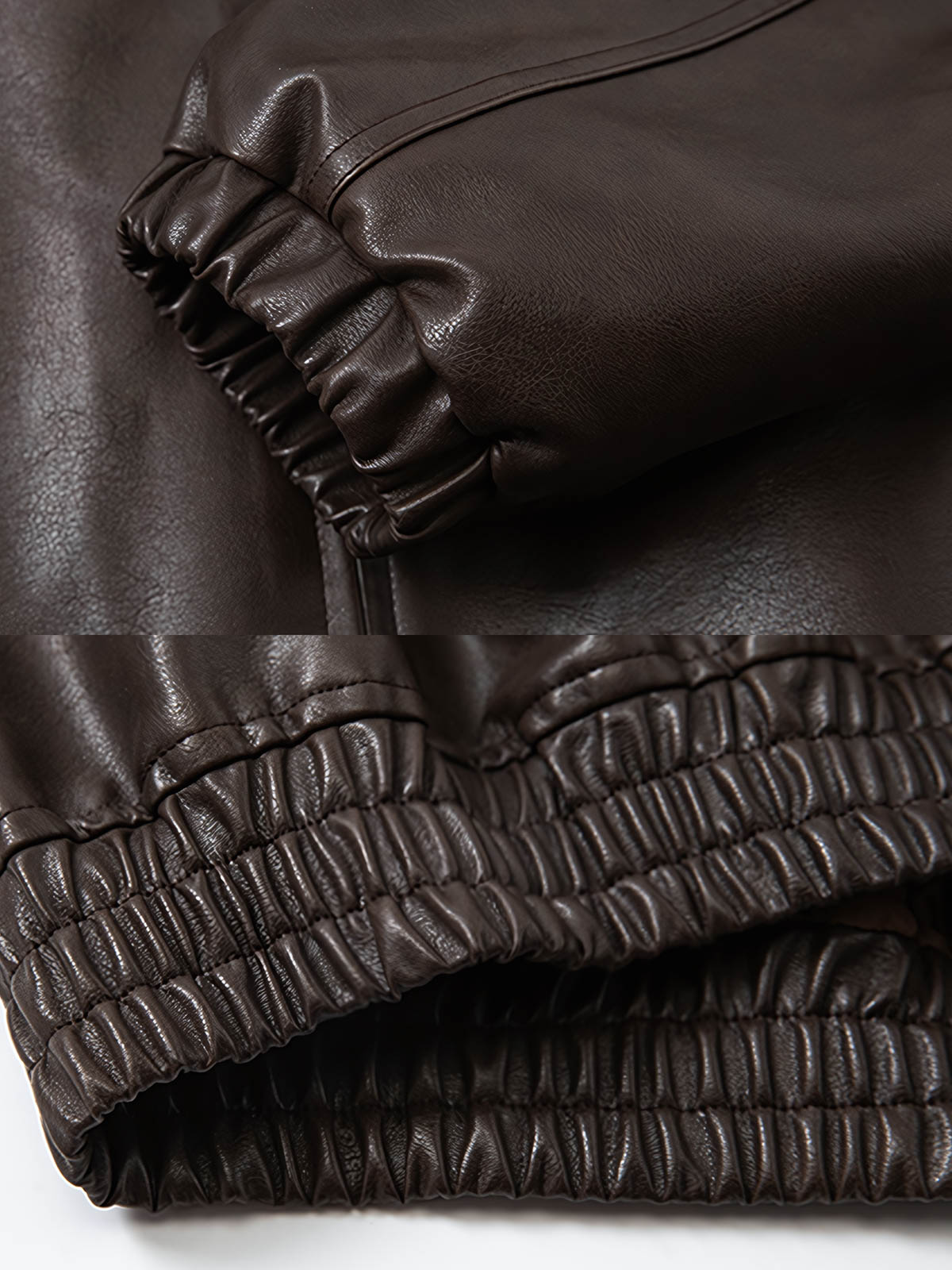 製品画像: アメカジ風 ワイドシルエット PUレザージャケット 秋冬用 ユニセックスの正面展示
詳細画像: ダブルジップポケットとゴム入り裾のディテール