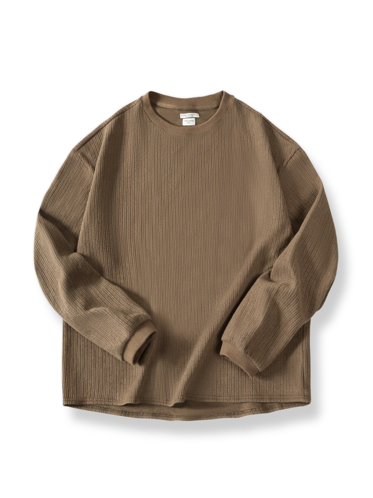 毛織りテクスチャーが際立つゆったりフィットニットセーター。