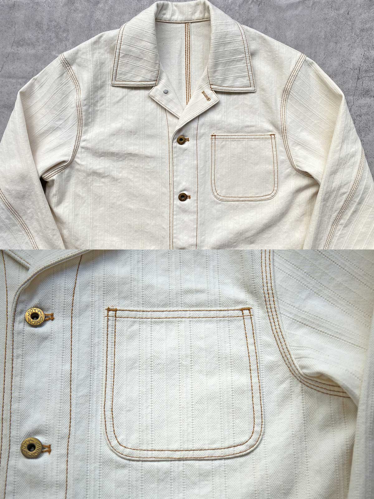 製品画像:
アイボリーヘリンボーン織りのワークジャケット全体画像。クラシックで高級感あるデザイン。

詳細画像:
コントラストステッチのディテール。精巧な縫製がジャケットの魅力を引き立てます。