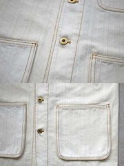 製品画像:
アイボリーヘリンボーン織りのワークジャケット全体画像。クラシックで高級感あるデザイン。

詳細画像:
コントラストステッチのディテール。精巧な縫製がジャケットの魅力を引き立てます。