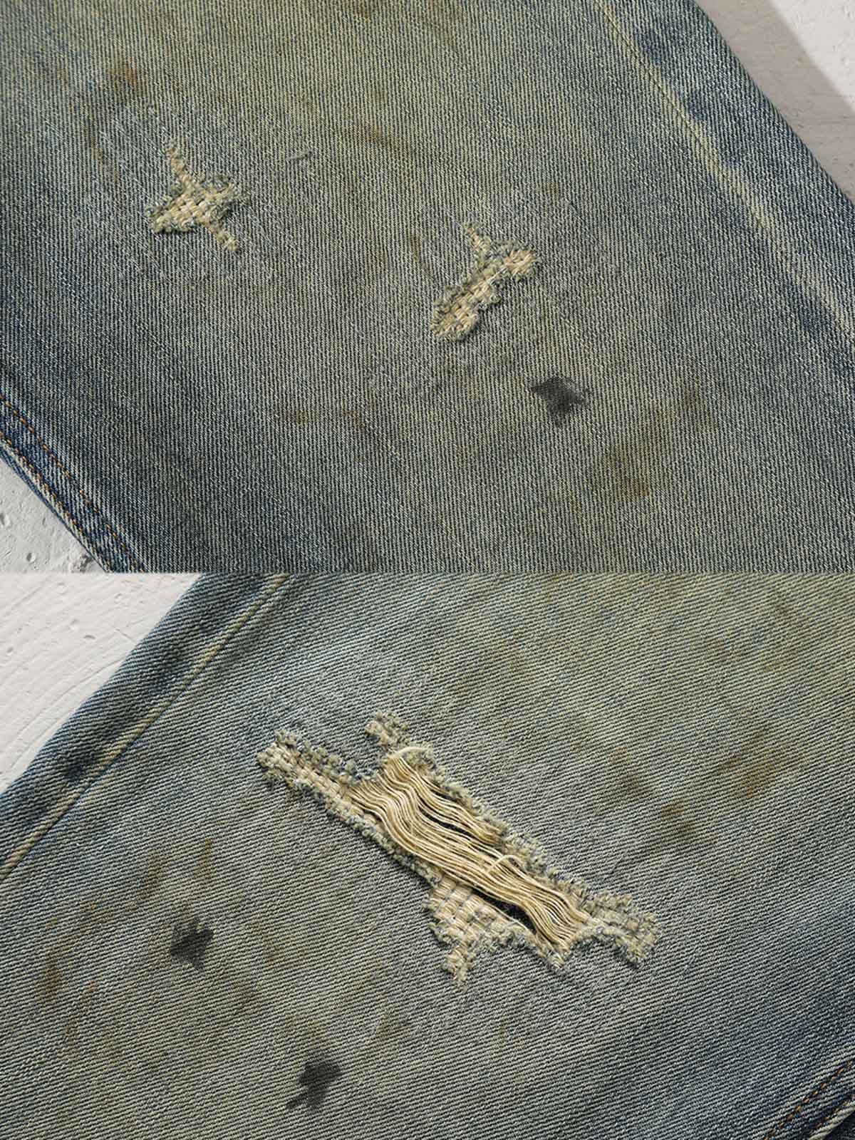 フレアパンツの三角形切り替えデザインとダメージ加工のディテール