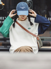 詳細画像: 袖口の配色と胸のヴィンテージ小エンブレムのディテール画像