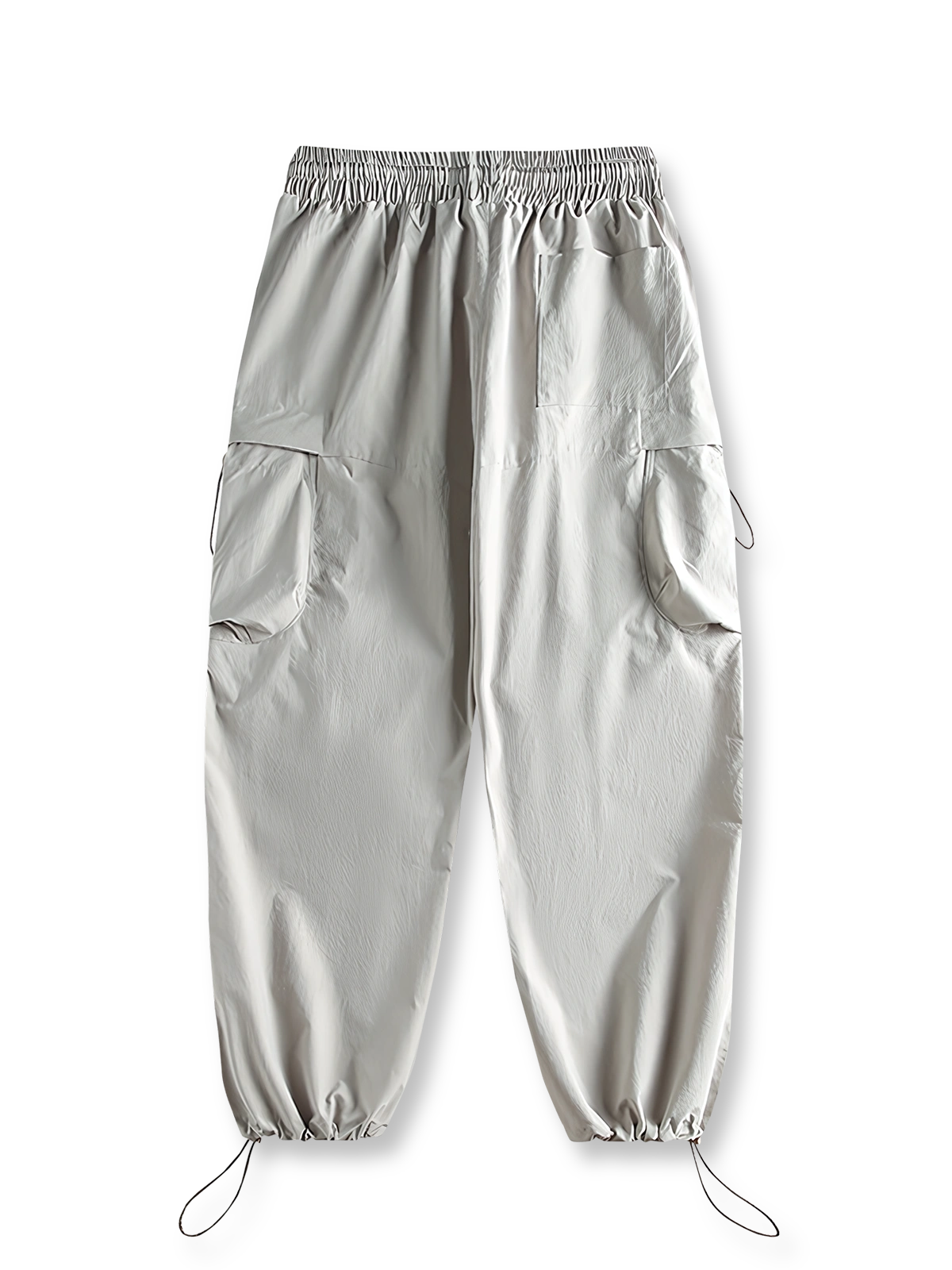 製品画像: 空挺兵スタイルのカーゴパンツ、ドローストリング付きで機能性が際立つデザイン。
詳細画像: 立体ポケットと膝のダブルタックのディテールが分かるクローズアップショット。