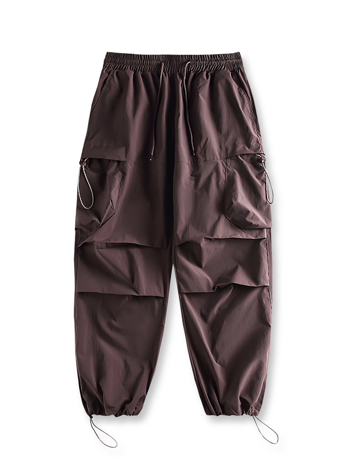 製品画像: 空挺兵スタイルのカーゴパンツ、ドローストリング付きで機能性が際立つデザイン。
詳細画像: 立体ポケットと膝のダブルタックのディテールが分かるクローズアップショット。