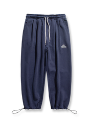 裾絞り 刺繍入り スウェットパンツ