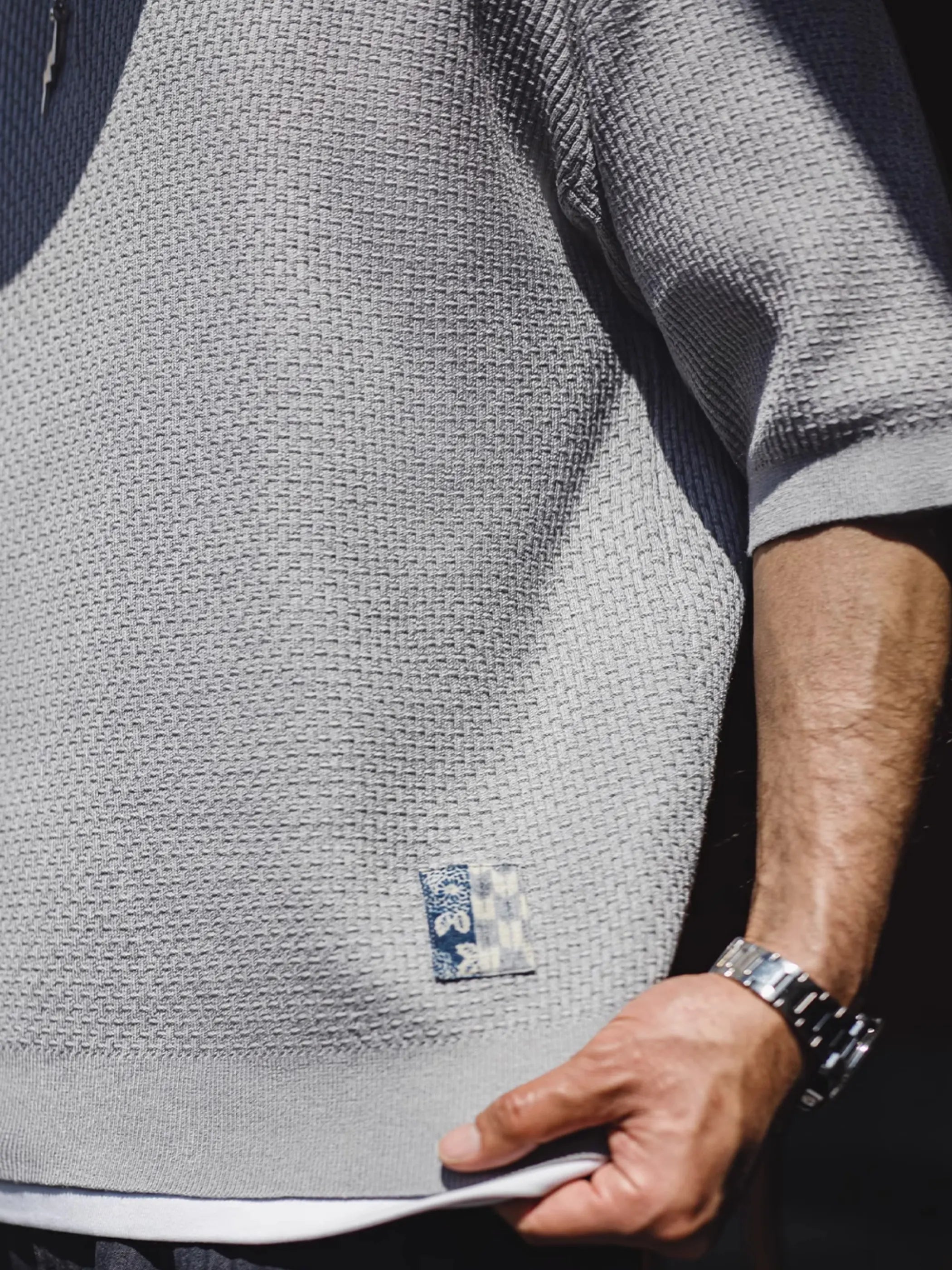 フロント全体の竹節編みヘンリーショートスリーブニット